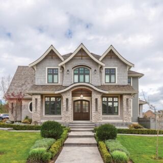 Beautiful exterior of newly built luxury home. Yard with green grass and walkway lead to front entrance.; Shutterstock ID 1417441433; Purchase Order: ASHG 2020; Client/Licensee: Becky Murry