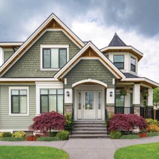 Residential family house with concrete pathway over green lawn. Family house with car parked on side; Shutterstock ID 1447503068; Purchase Order: Last 21; Job: 02192020; Client/Licensee: TT